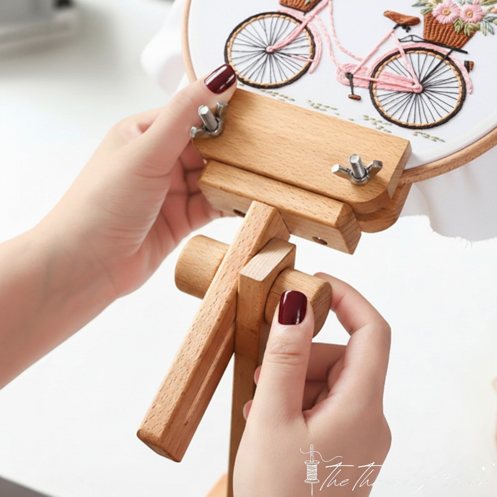 Clamp-on needlework stand holding a hoop at working height