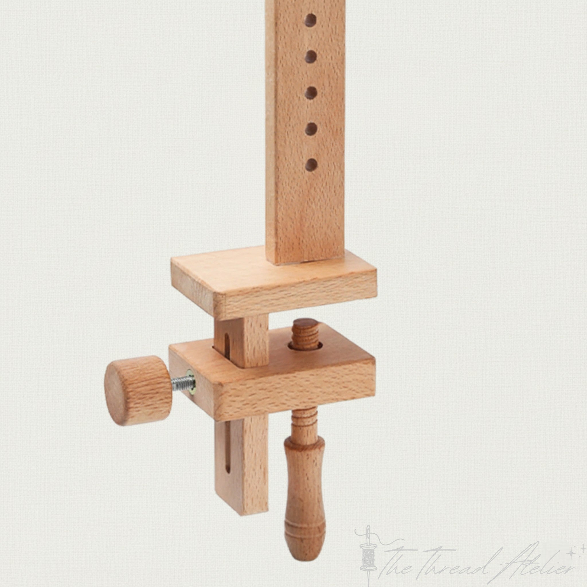 Embroidery hoop holder set to a tilted stitching angle