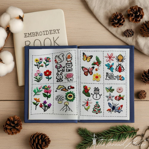Open stitch sampler book showing embroidered practice squares