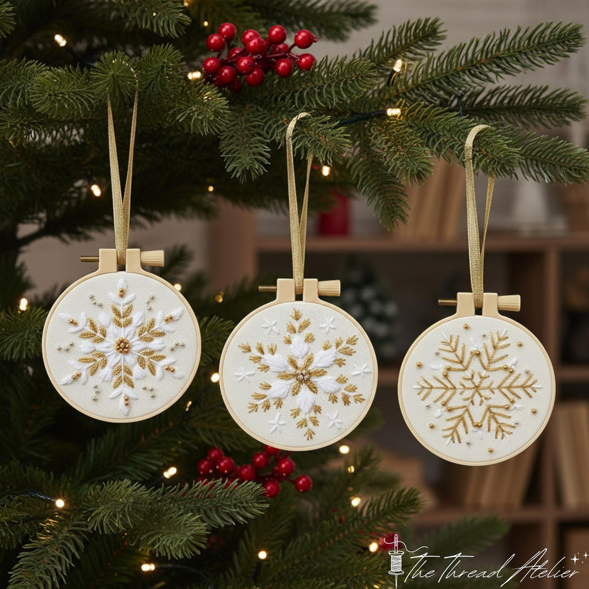 Gold and white snowflake hoop standing on a wooden table beside beads and scissors