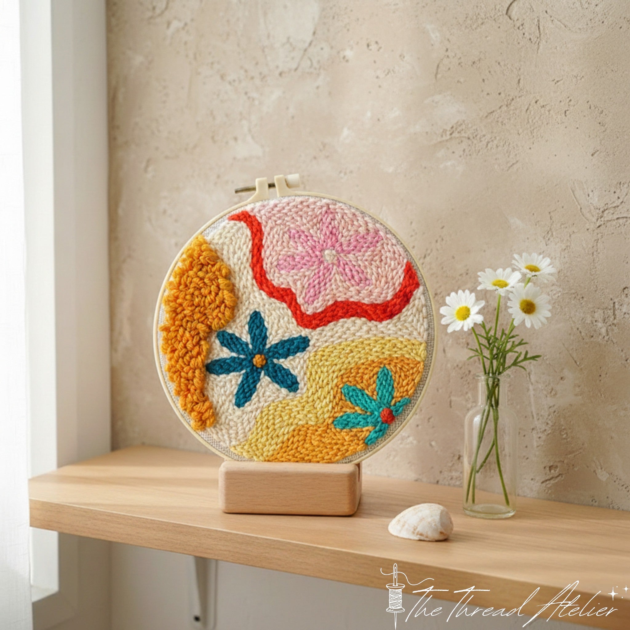 Abstract flower punch needle design in vivid contrasting yarns