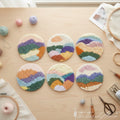 Punch needle kit with abstract colored horizon coaster designs