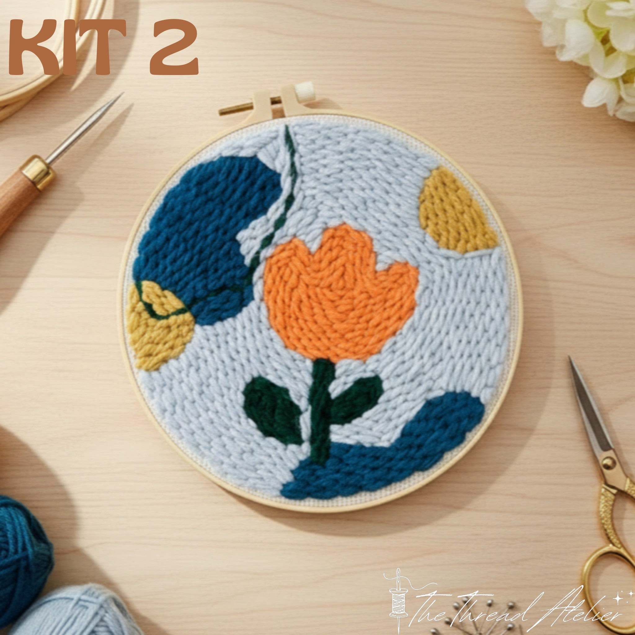 Modern punch needle floral design showing its looped yarn texture