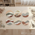 Punch needle kit with abstract mountain landscape coaster designs