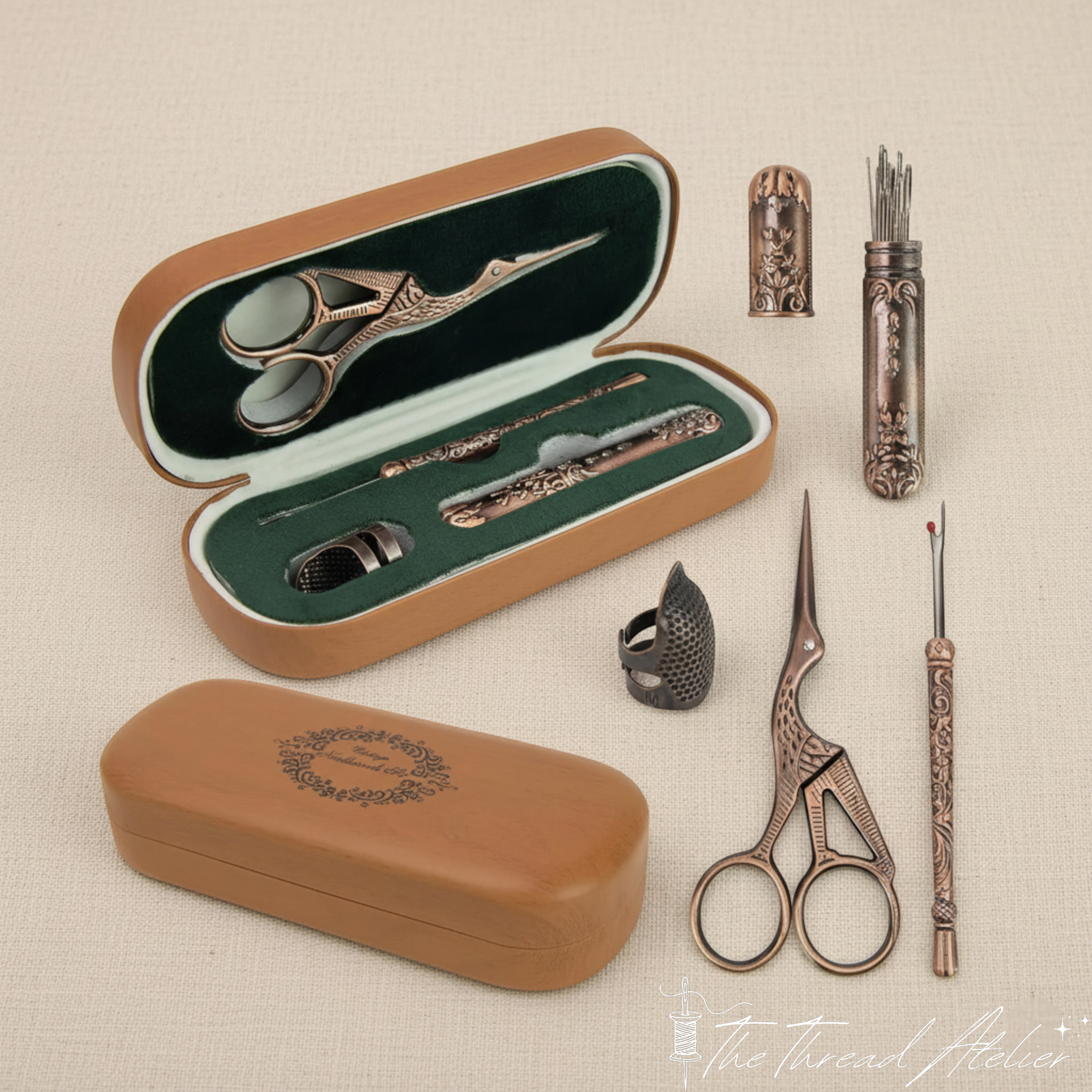 Vintage sewing set opened to show its scissors, thimble and needles